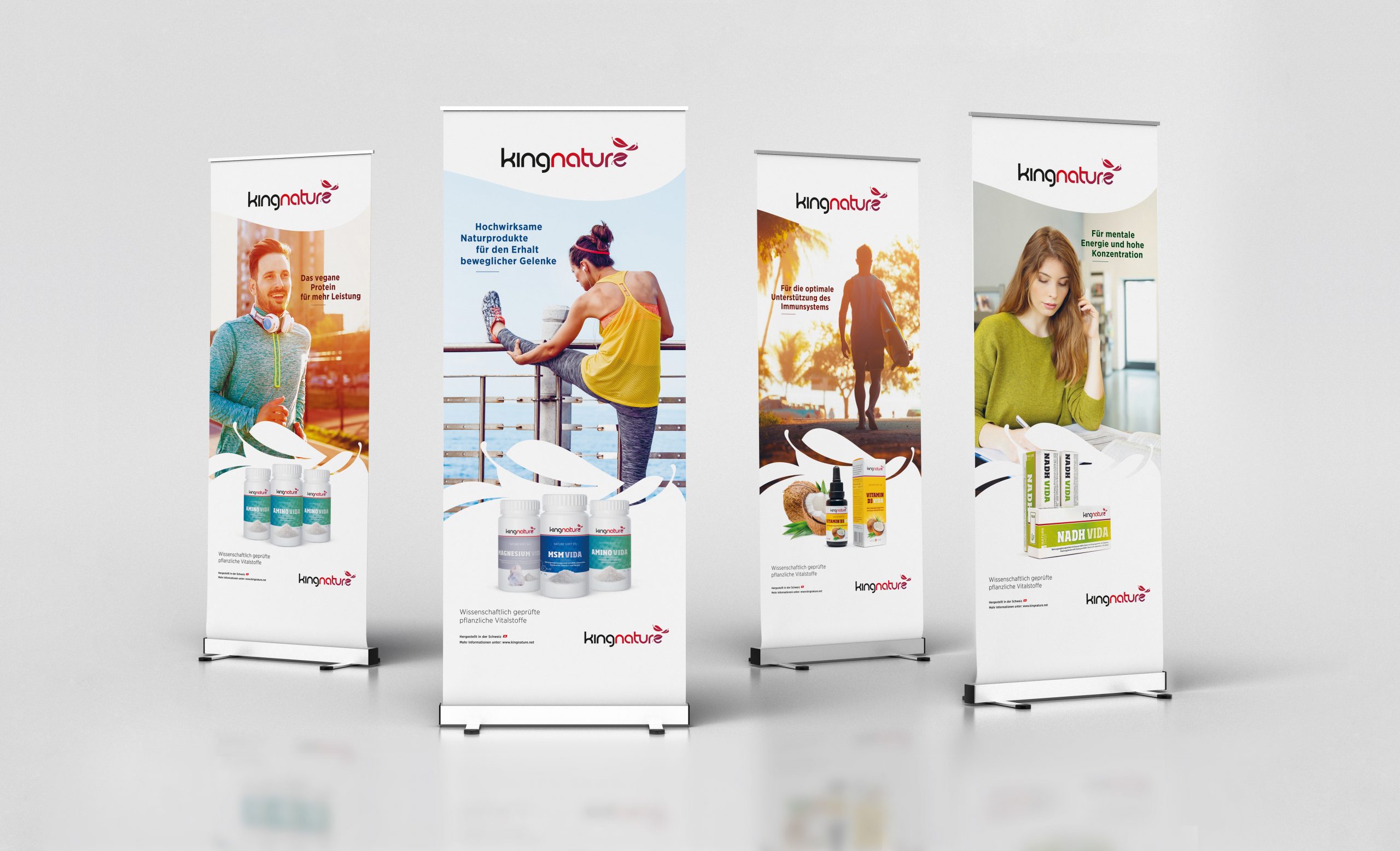 Three blank roll up banner display stands on white background, include clipping path around banner poster. 3d render